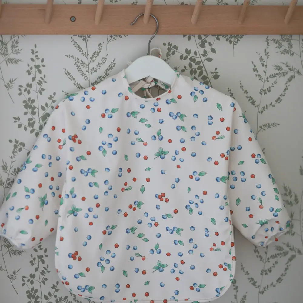 Rätt Start Beskow Putte i Blåbärsskogen Haklapp med erme